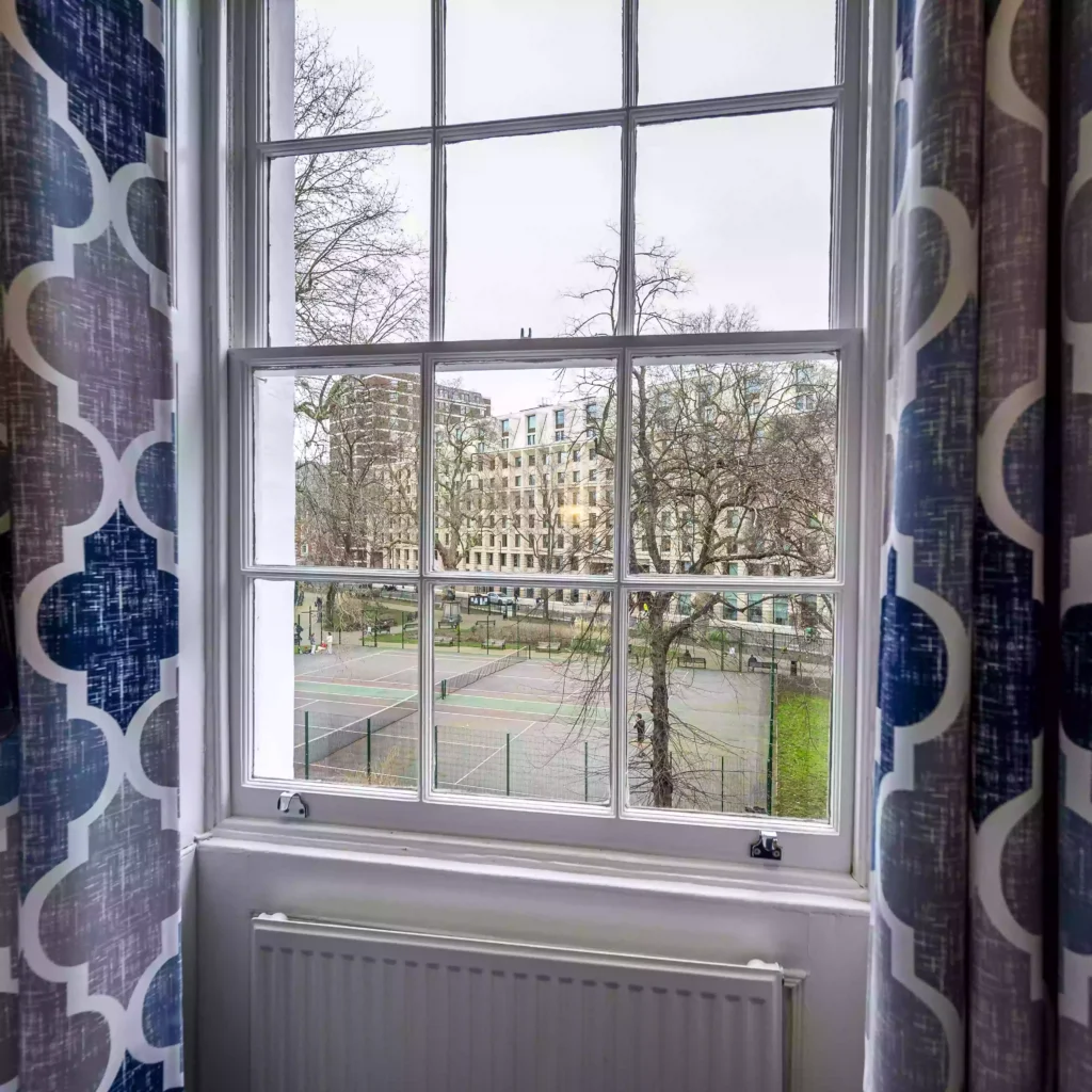 Outside view of the Mentone Hotel through a window