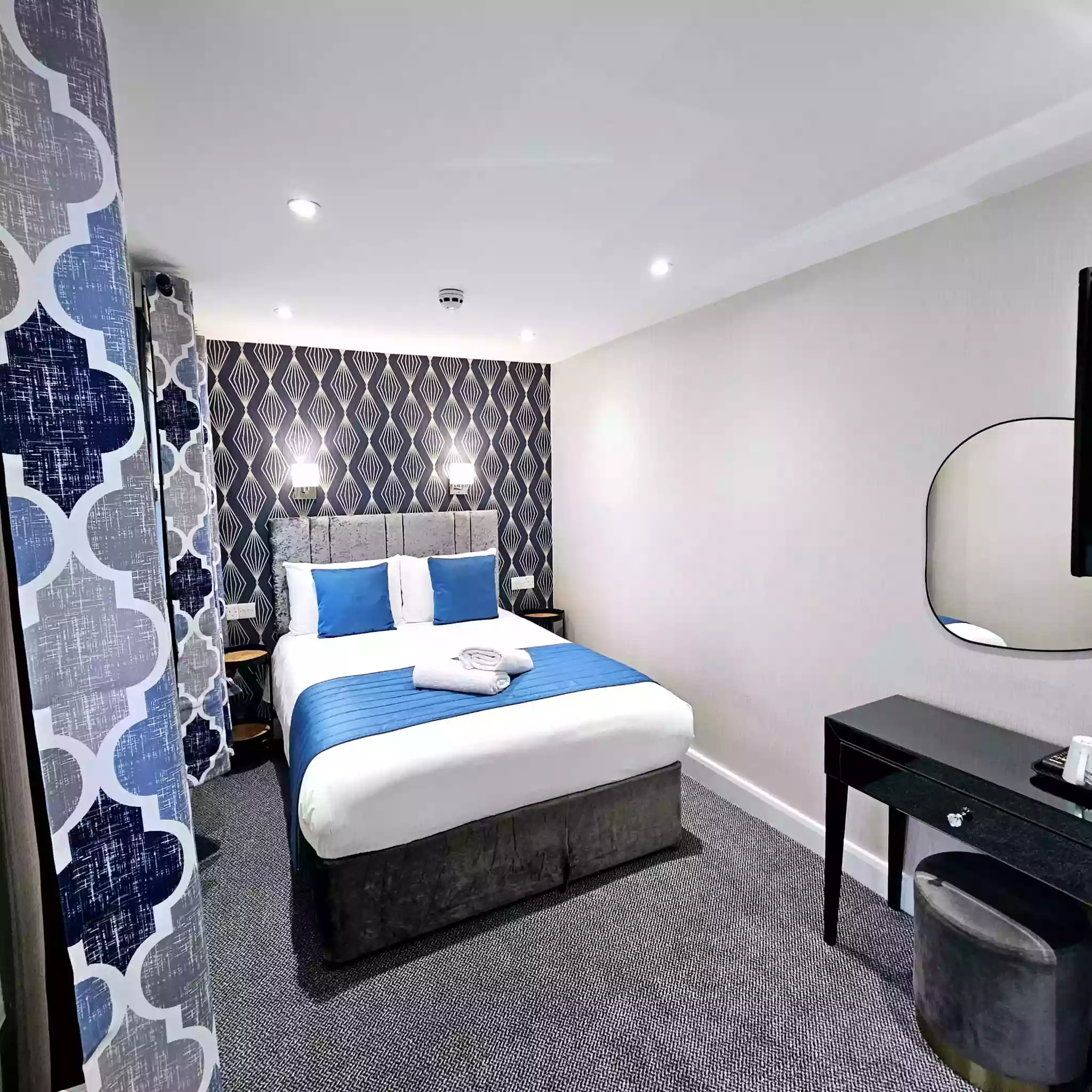 Modern Mentone Hotel room showcasing a double bed