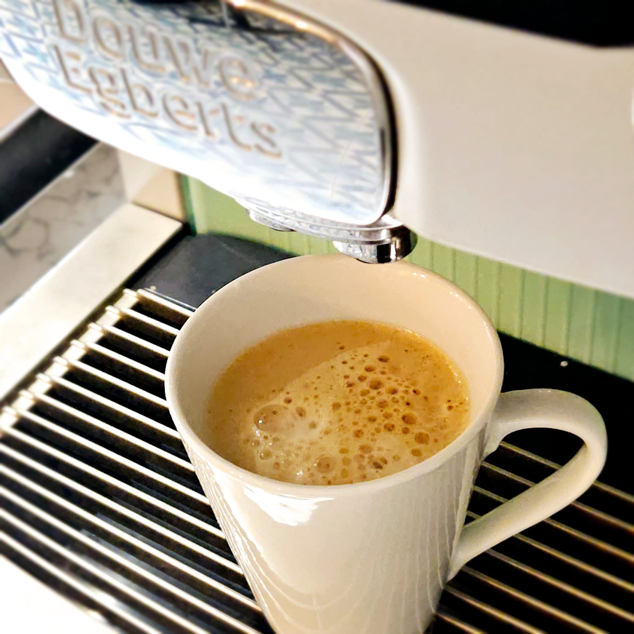 A cup filled with coffee from a coffee machine